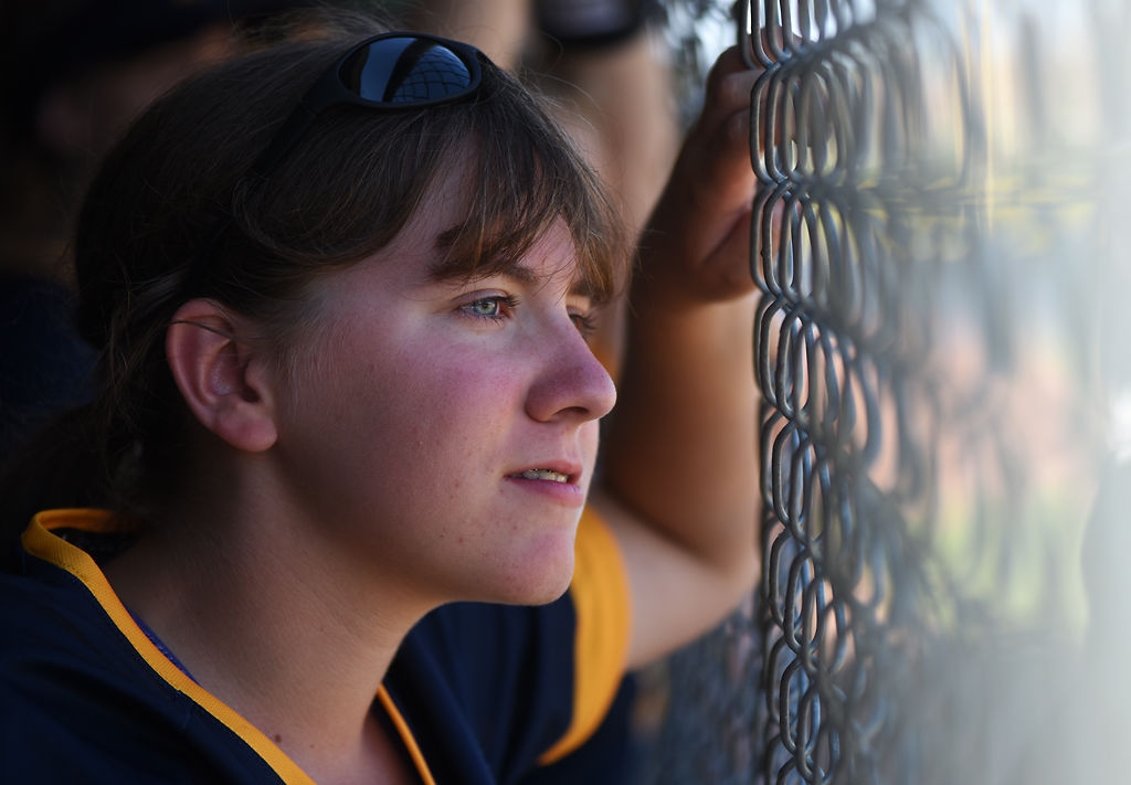 Libby Stiles watches her team play against Helias High School